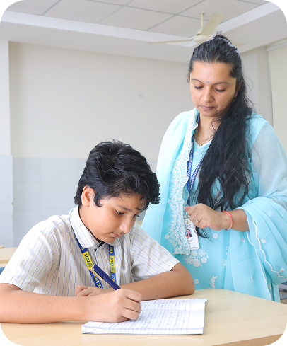 Teacher helping a nursery student
